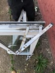 Replacement of window hinges Erith BEFORE, see below for after